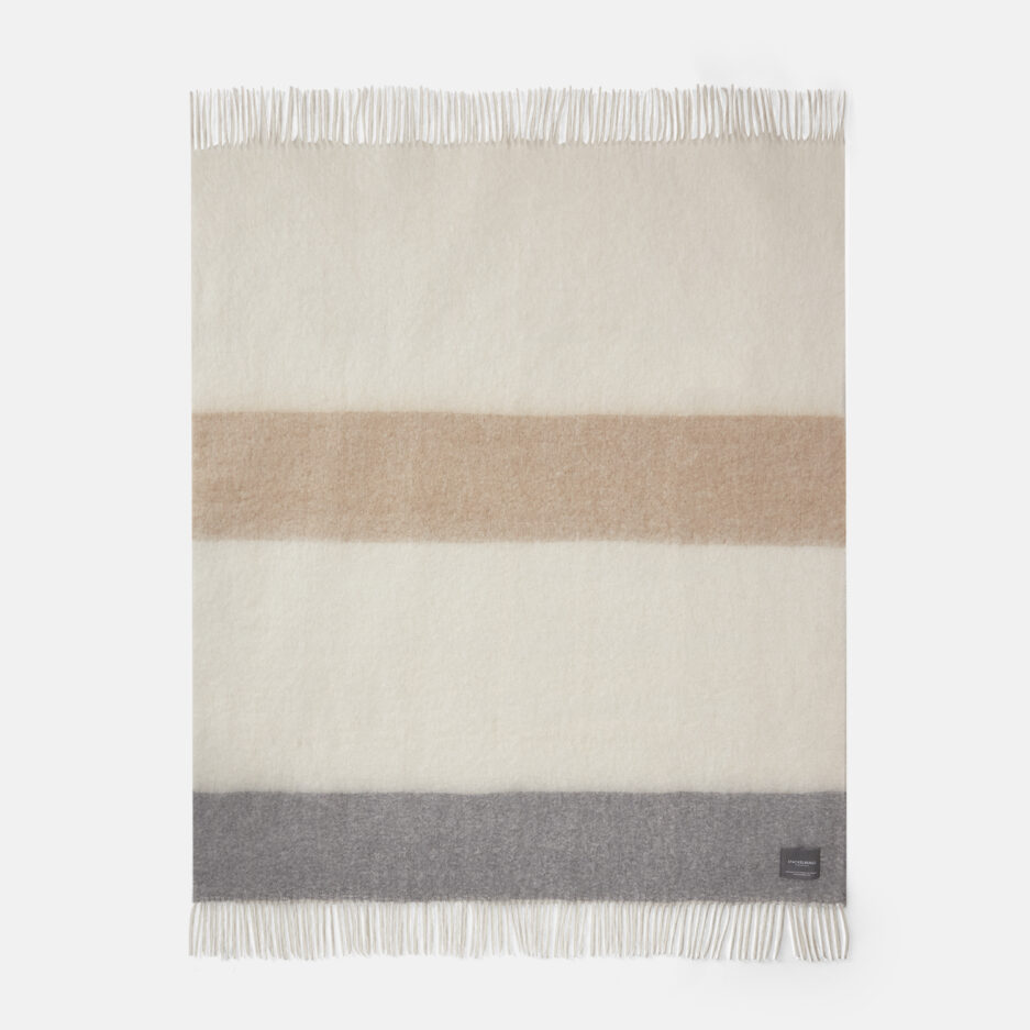 A luxurious fully unfolded camel & skiffer striped Mohair plaid on a white backdrop.