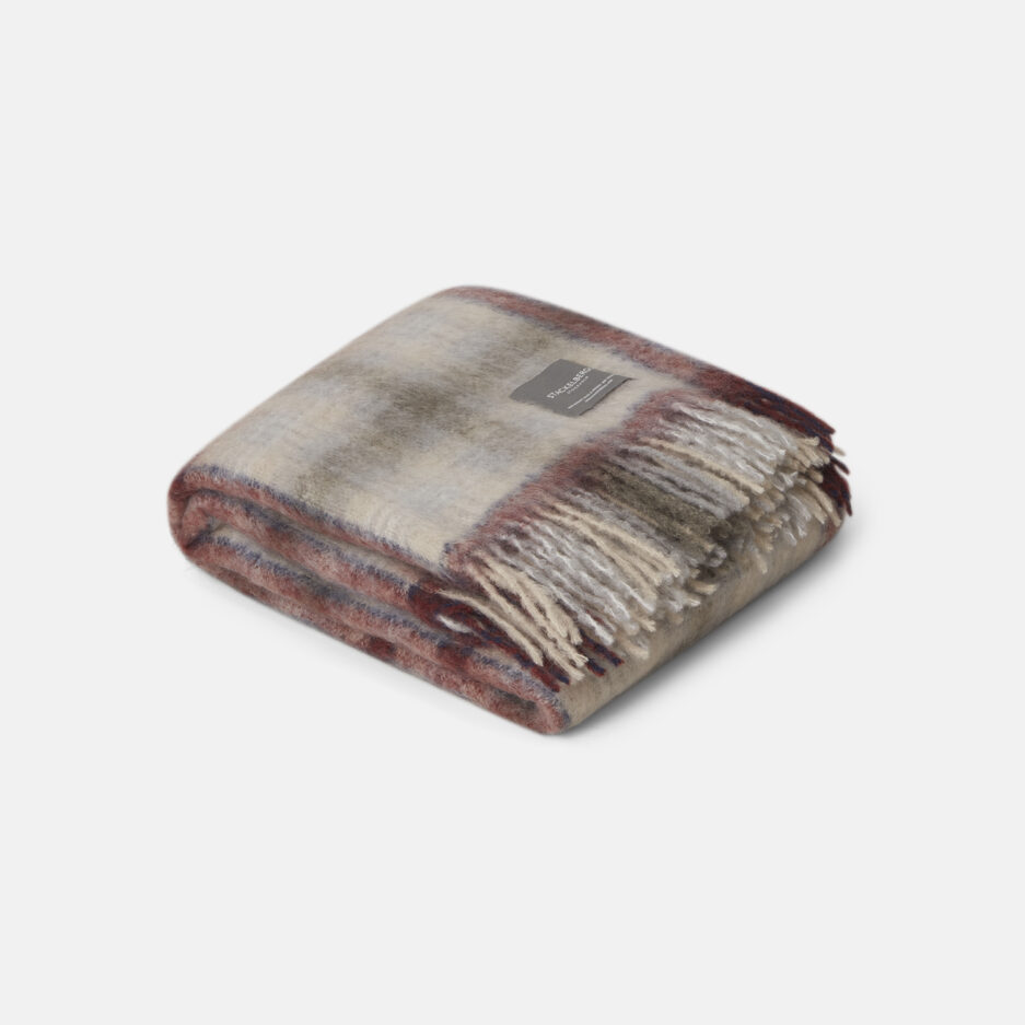 A luxurious camelbeige & fried check Mohair plaid on a white backdrop.