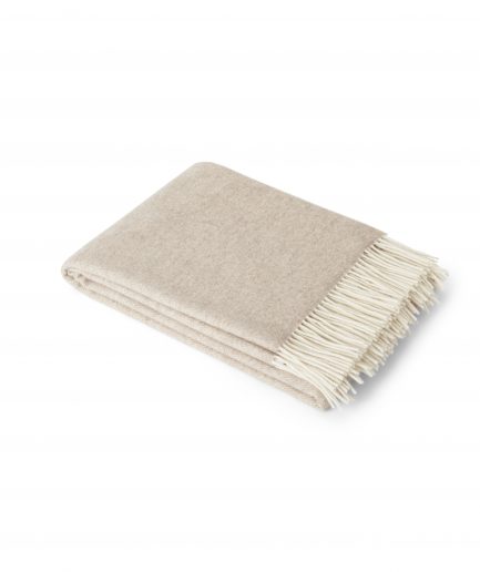 A luxurious Merino & Cashmere two tone light taupe wool plaid on a white backdrop.