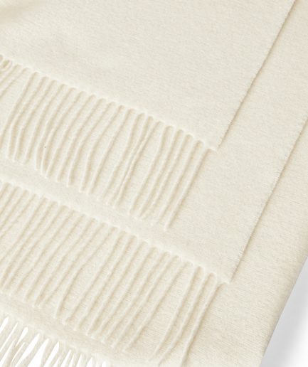 Close-up of a luxurious Merino & Cashmere two tone Offwhite plaid on a white backdrop.