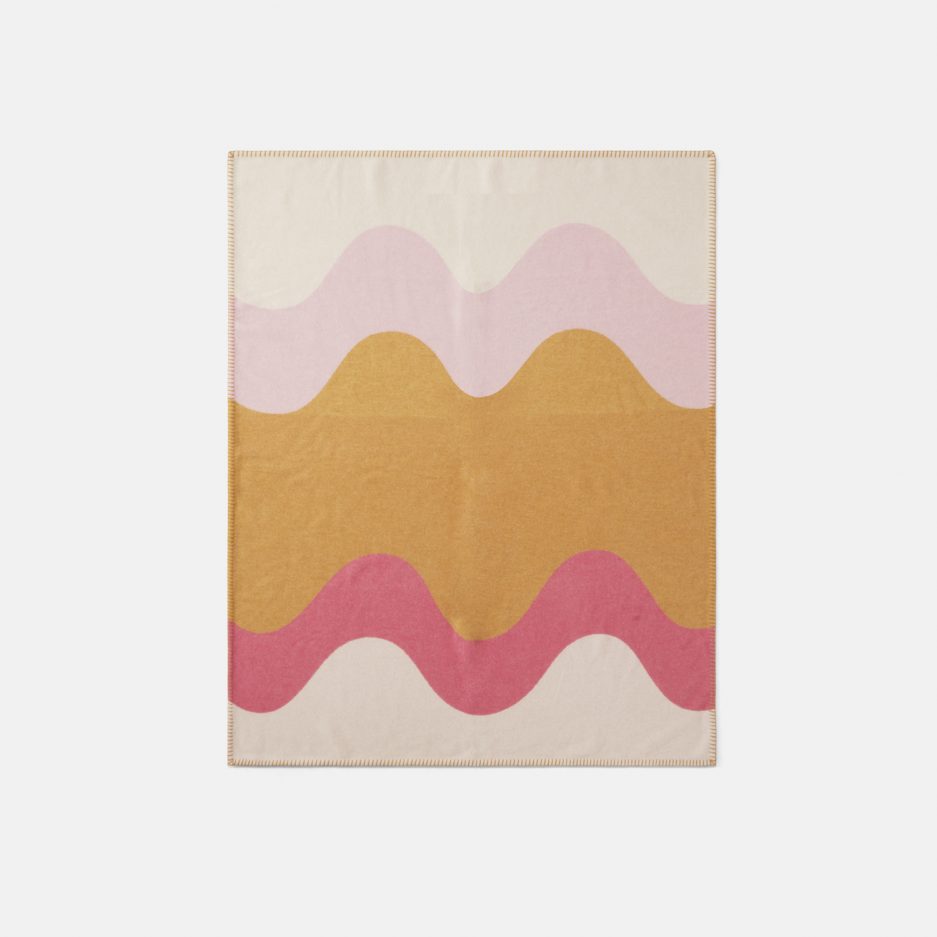 A luxurious fully unfolded Modulo Ocra, Pink & Yellow wool plaid Designed with Rosehof Art Factory on a white backdrop.