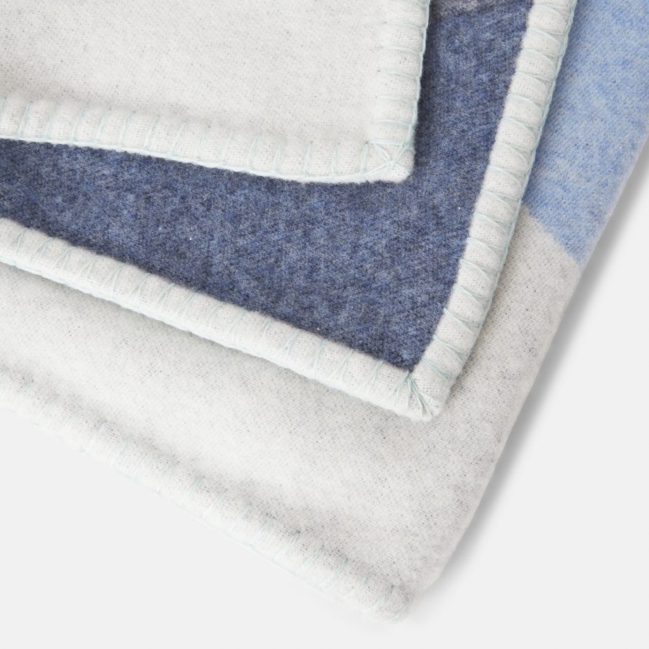 Close-up on a luxurious Light Blue, Denim, Sea Foam wool plaid Designed with Rosehof Art Factory on a white backdrop.