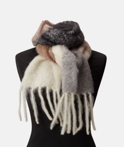 A luxurious colorful stripe scarf/ mohair plaid in brown, black and rose on a white backdrop.